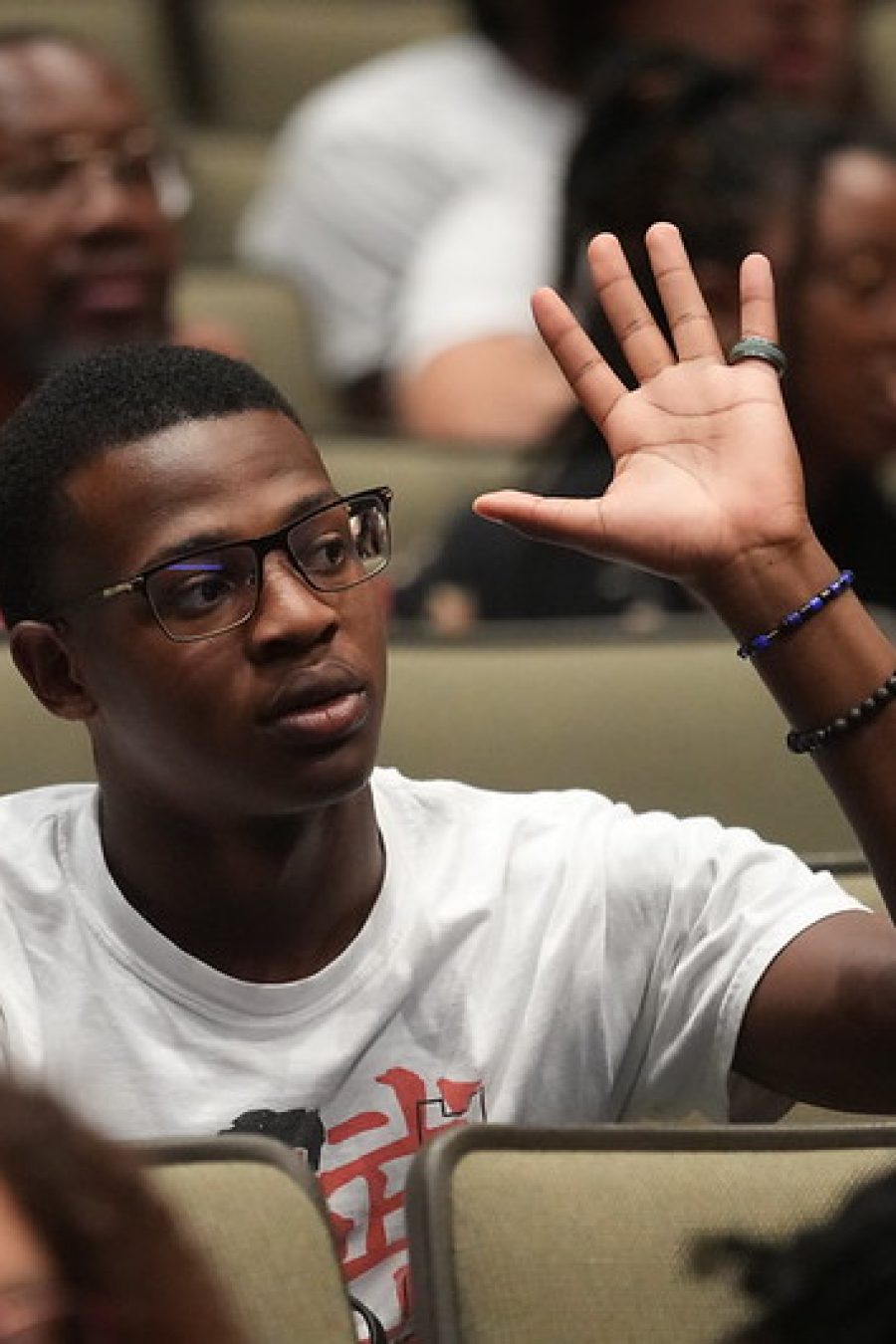 Student raising his hand at the Harambee March